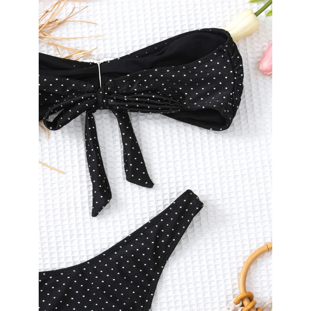 Polka dots bandeau bikini set with matching sarong, three-piece ensemble, polyester spandex blend, wire-free support, low waist, women's dot swimwear, playful and retro style.