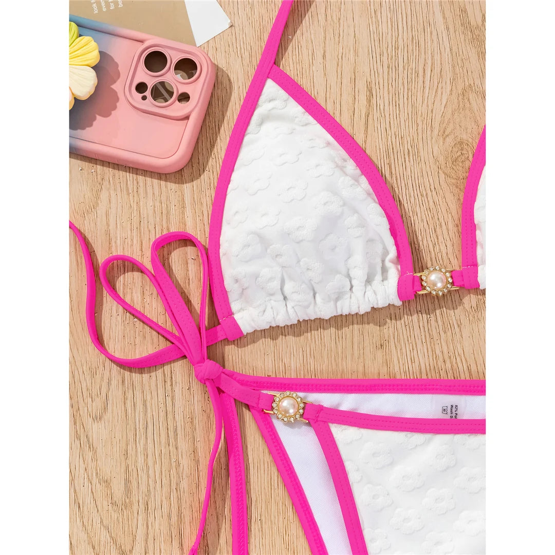 Pearl rhinestones halter high cut bikini in solid white for a glamorous and sophisticated beach style.