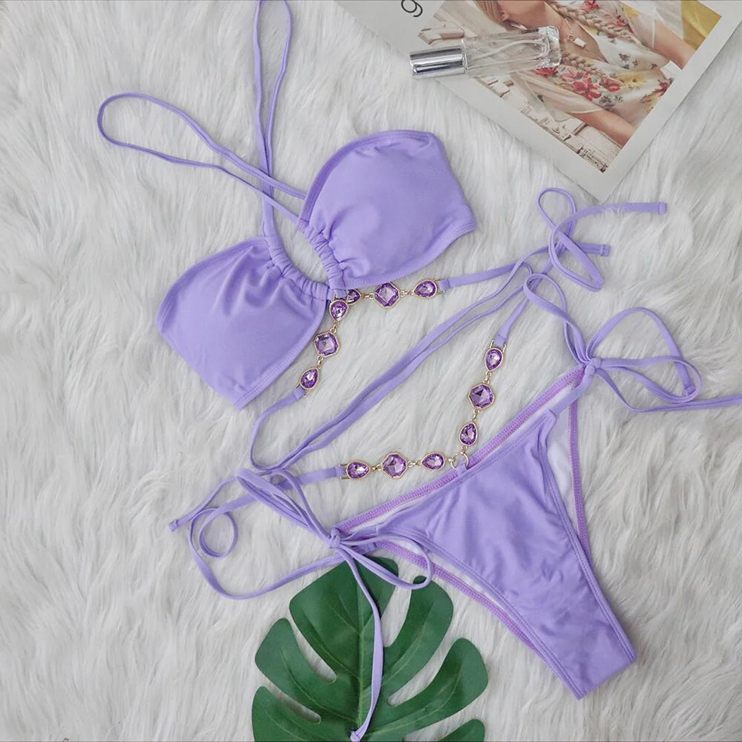 Lake Blue, Camel, Pink, Light Green, Light Purple Two-Piece Diamond Rhinestones Wrap Around Bikini Set. Solid Swimwear made with Nylon and Spandex material. Features Wire-Free Support, Low Waist, and True to Size fitting. Padded for added comfort. Available Sizes: S, M, L. Perfect for Middle-Aged women and adults. In stock with free shipping.