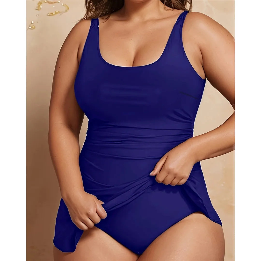 Backless solid padded plus size one piece swimsuit for women with adjustable straps and sophisticated design in monochrome colors.